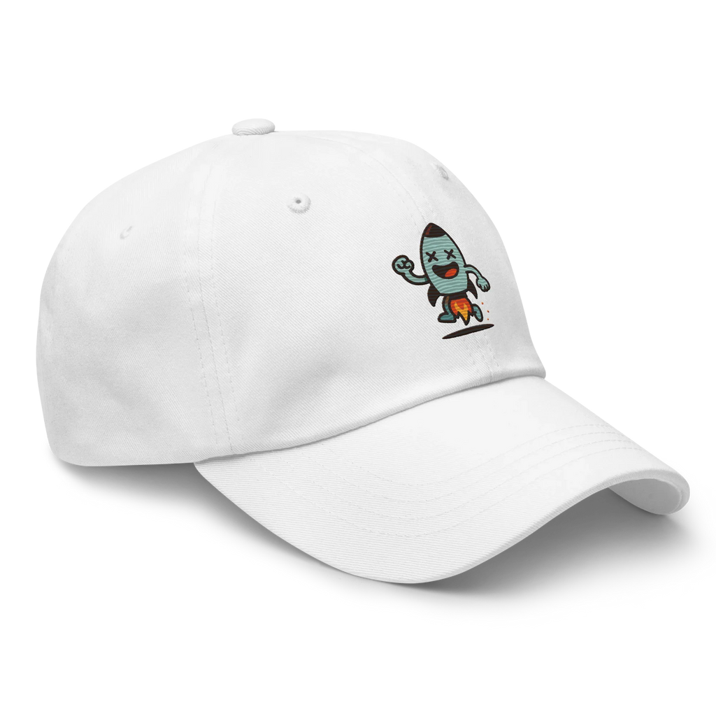 Gorra blanca Doozy Headwear con dibujo de cohete animado en el frontal